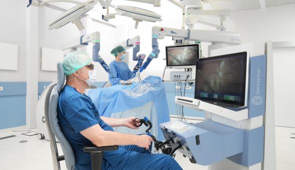 A doctor sitting in front of a monitor