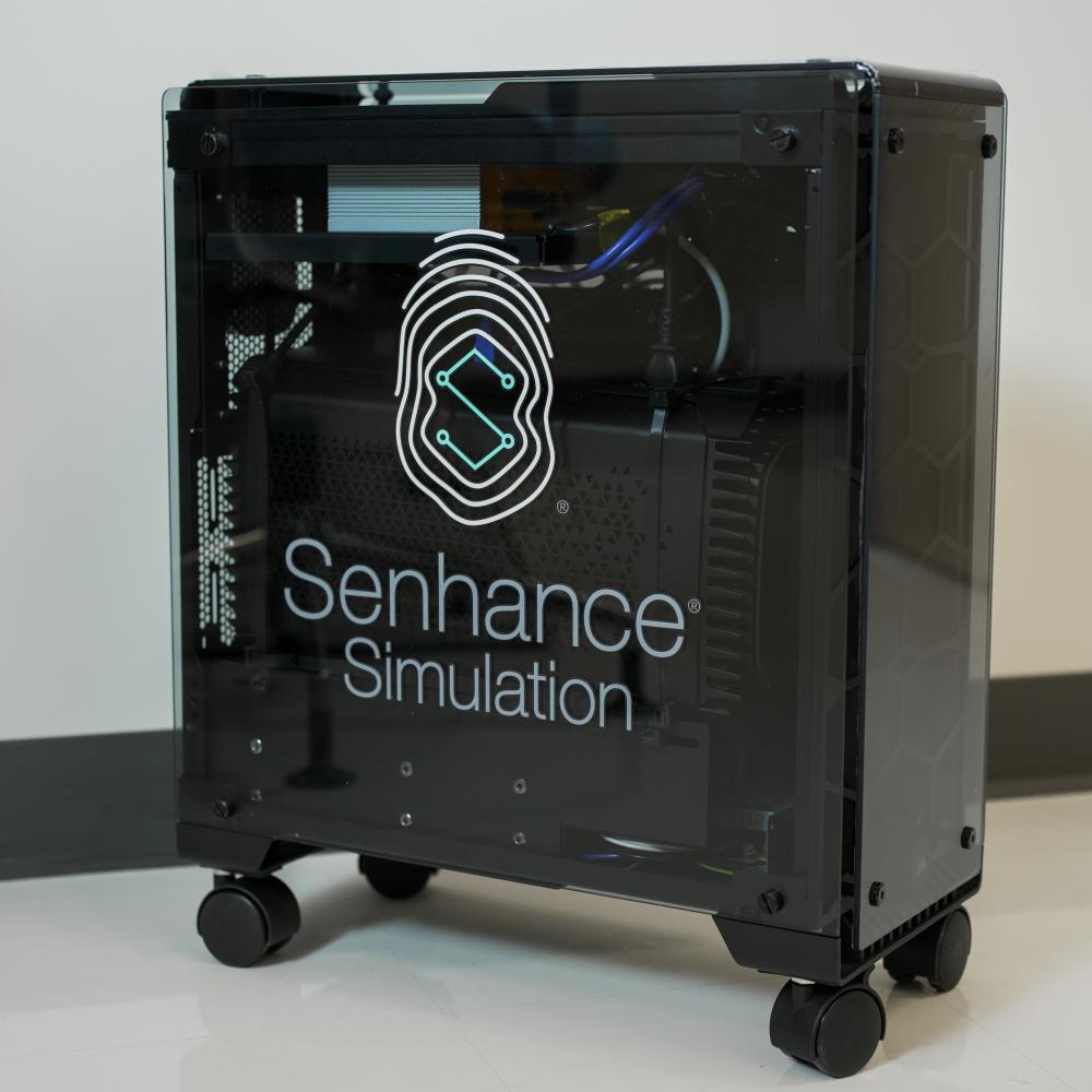 A desktop computer with Senhance Simulation on the side